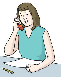 Frau hat ein rotes Telefon in der Hand.